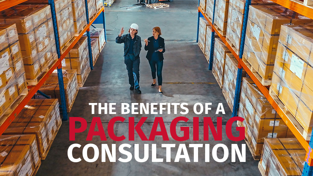 During the packaging consultation a consultant walks through a storage warehouse with a customer.