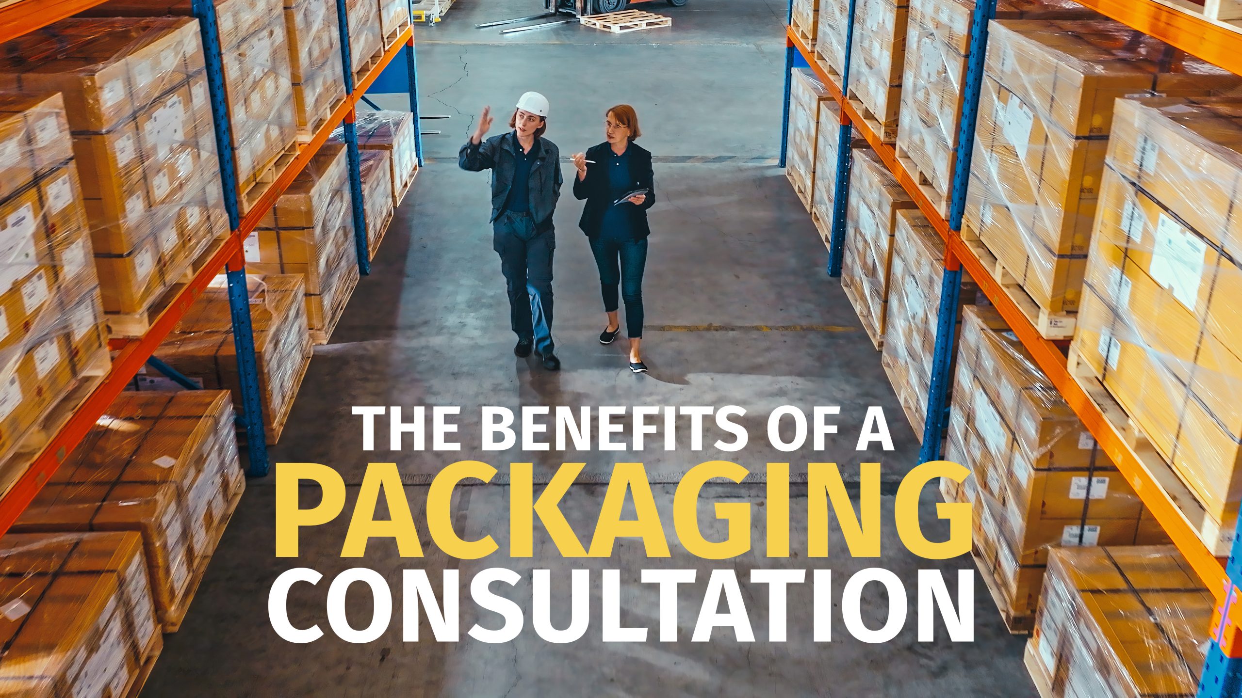 During the packaging consultation a consultant walks through a storage warehouse with a customer.